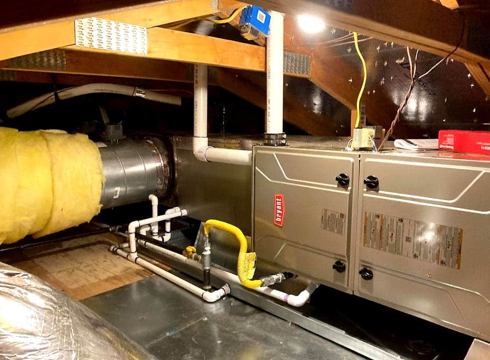 Horizontal furnace installed in an attic with gas line and ducting
