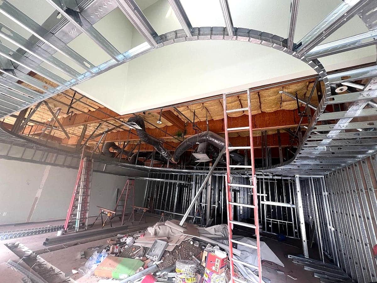 Commercial interior buildout with a curved ceiling feature and HVAC rough-in