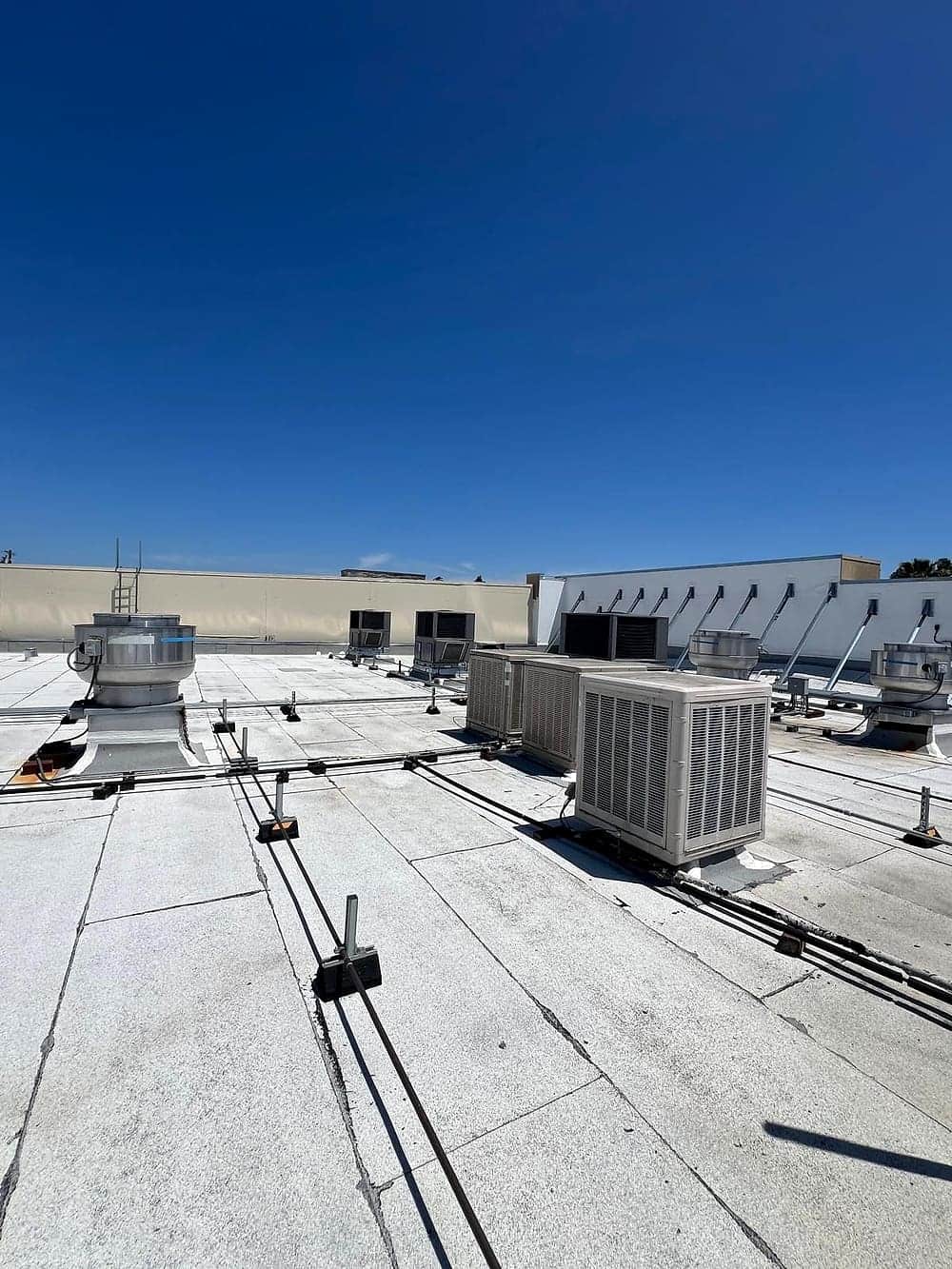 Rooftop HVAC package units on a commercial building