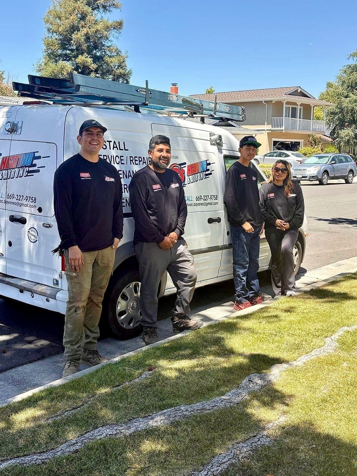 The Jr's Heating & Air family team beside the company van